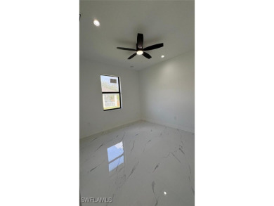This stunning new construction features impact windows and doors - photo 18