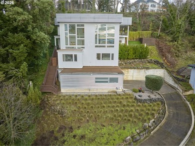 Perched high in the Vancouver Heights, this timeless modern home - photo 2