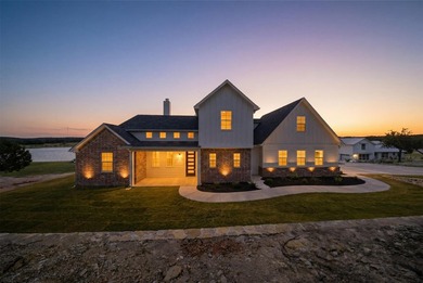 Discover your dream lakeside home featuring almost 300 feet of - photo 2