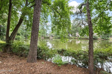 Tucked beneath a canopy of moss-draped oaks in the prestigious - photo 5