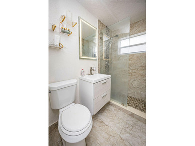 Welcome to this charming single-story residence in Golfview - photo 25
