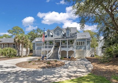 Set on a beautifully manicured half-acre lot overlooking the - photo 1