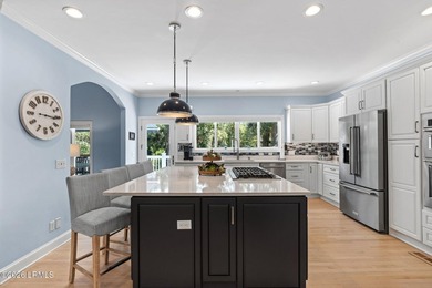 Set on a beautifully manicured half-acre lot overlooking the - photo 4