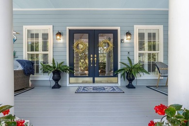 Set on a beautifully manicured half-acre lot overlooking the - photo 5