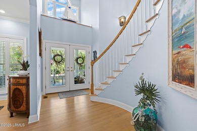 Set on a beautifully manicured half-acre lot overlooking the - photo 9
