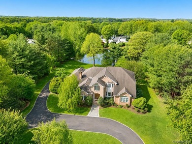Framed by sweeping pond views and surrounded by over 2 private - photo 1