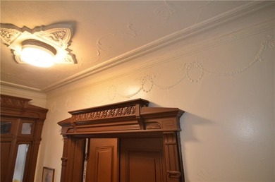 Welcome to this charming three-family brownstone, ideally - photo 9