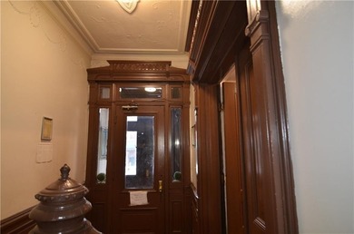 Welcome to this charming three-family brownstone, ideally - photo 10