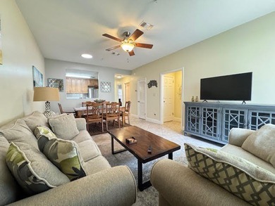 This fully furnished ground floor condo has tile floor and - photo 1