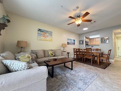 This fully furnished ground floor condo has tile floor and - photo 2