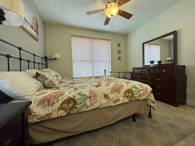 This fully furnished ground floor condo has tile floor and - photo 10