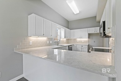 This stunning condo in Sunset Bay Villas offers a