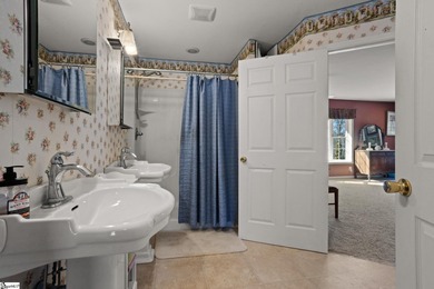 Set on 3.55 waterfront acres, this one-level custom home offers