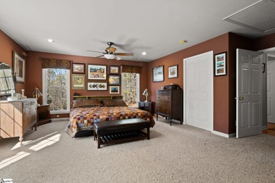 Set on 3.55 waterfront acres, this one-level custom home offers