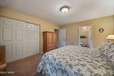 Tucked away in the tall pines of Pineridge, this beautifully