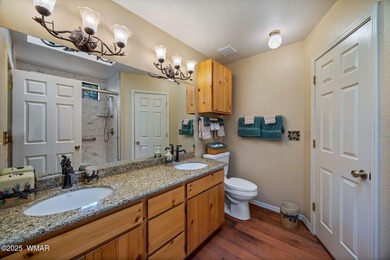 Tucked away in the tall pines of Pineridge, this beautifully