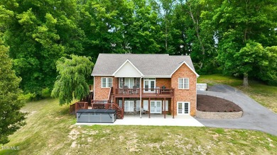 Luxury lake living meets breathtaking mountain views in this - photo 5