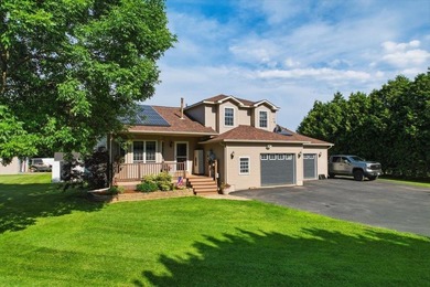 Set on 1.17 private acres in the heart of Grand Isle, this - photo 2