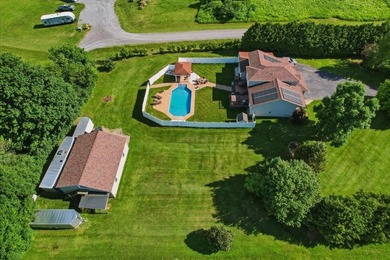 Set on 1.17 private acres in the heart of Grand Isle, this - photo 3