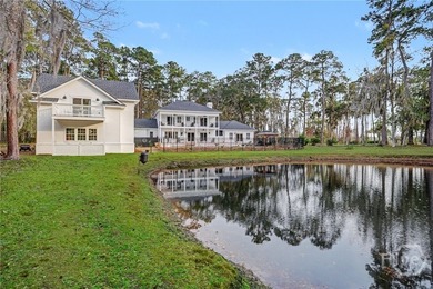 Set on four private acres off coveted Green Island Road, this - photo 32