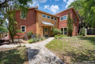 This stunning waterfront home on Faurie Point boasts a modern - Lake Home For Sale in Lakehills, Texas