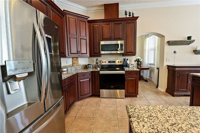 Discover this spacious 5-bedroom, 3-bathroom home set on a - photo 8