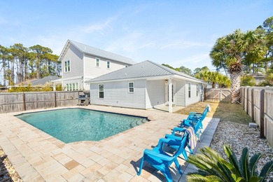 This well-located 3-bedroom, 2-bathroom home on the highly - photo 1