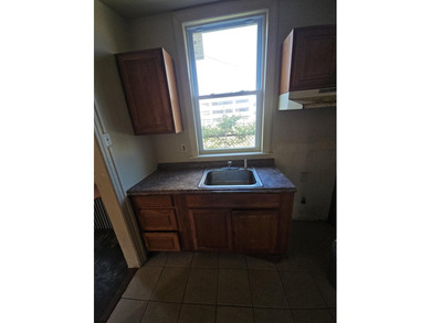 Prime Location with Exceptional Potential! This 3-bedroom - photo 9
