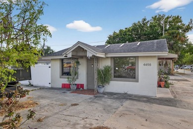 Located at 4498 49th St N, this versatile commercial building - photo 1