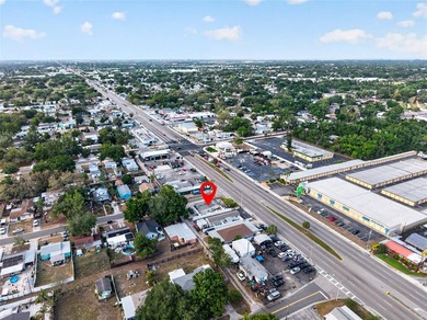Located at 4498 49th St N, this versatile commercial building - photo 4