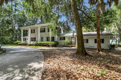 Nestled on 1.48 private acres in the exclusive waterfront - photo 1
