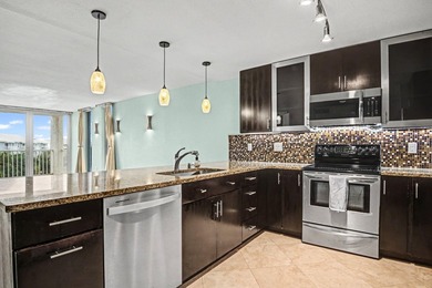 Wake up to shimmering harbor views and effortless coastal - photo 1