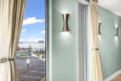Wake up to shimmering harbor views and effortless coastal - photo 9