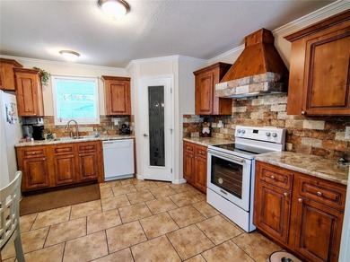 Situated on a corner lot is this newer home that has the perfect - photo 13