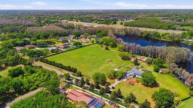 Positioned along the shores of Lake Kell in Lutz, this is a rare - photo 1