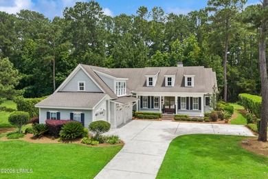 Nestled on a private wooded homesite in Hampton Hall, this - photo 1