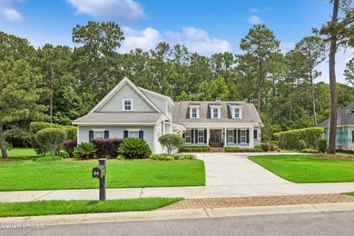 Nestled on a private wooded homesite in Hampton Hall, this - photo 2