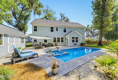 Beautifully set on a private, wooded lot in the sought-after - photo 2