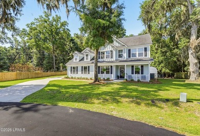 Beautifully set on a private, wooded lot in the sought-after - photo 3