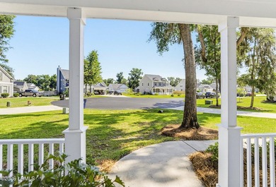 Beautifully set on a private, wooded lot in the sought-after - photo 6