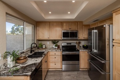 Located in a highly desired golf course complex, this - photo 13