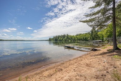Woman Lake living begins with 150 feet of shoreline, a sandy - photo 1