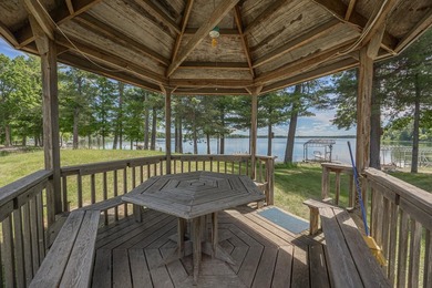 Woman Lake living begins with 150 feet of shoreline, a sandy - photo 5