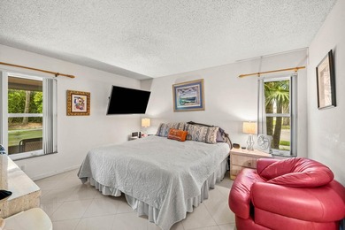 Tucked away as a private end-unit in desirable Town Villas, this - photo 18