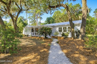 RARE FIND - Hidden beneath a canopy of majestic live oaks draped - photo 1