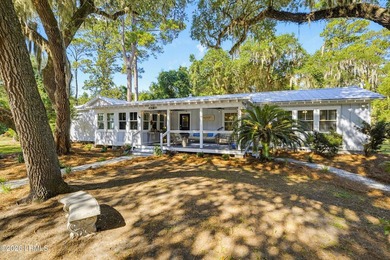 RARE FIND - Hidden beneath a canopy of majestic live oaks draped - photo 2