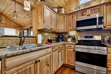 Situated on 1.9 private acres, this furnished mountain home - photo 30