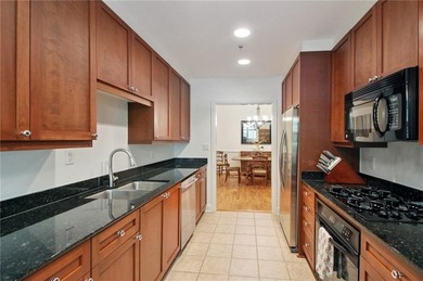 Truly a rare find, this stepless first-floor 2 bed, 2 bath condo