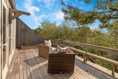 Set on 0.69 acres, bordering a two-acre dune preserve, this - photo 9