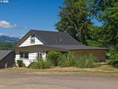 Perched above charming downtown Nehalem, this remodeled coastal - photo 1